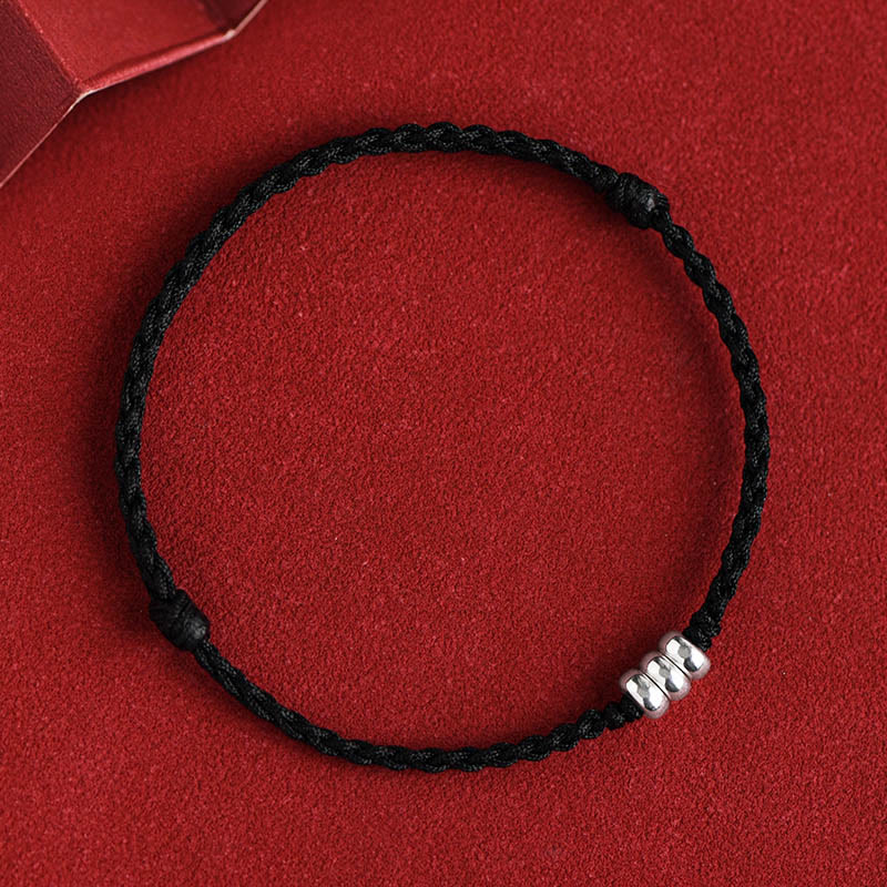 Black rope ankle bracelet with sterling silver beads and knotted adjustable design