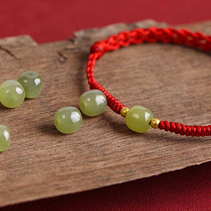 Barrel jade bead gold accents dark red protective bracelet
