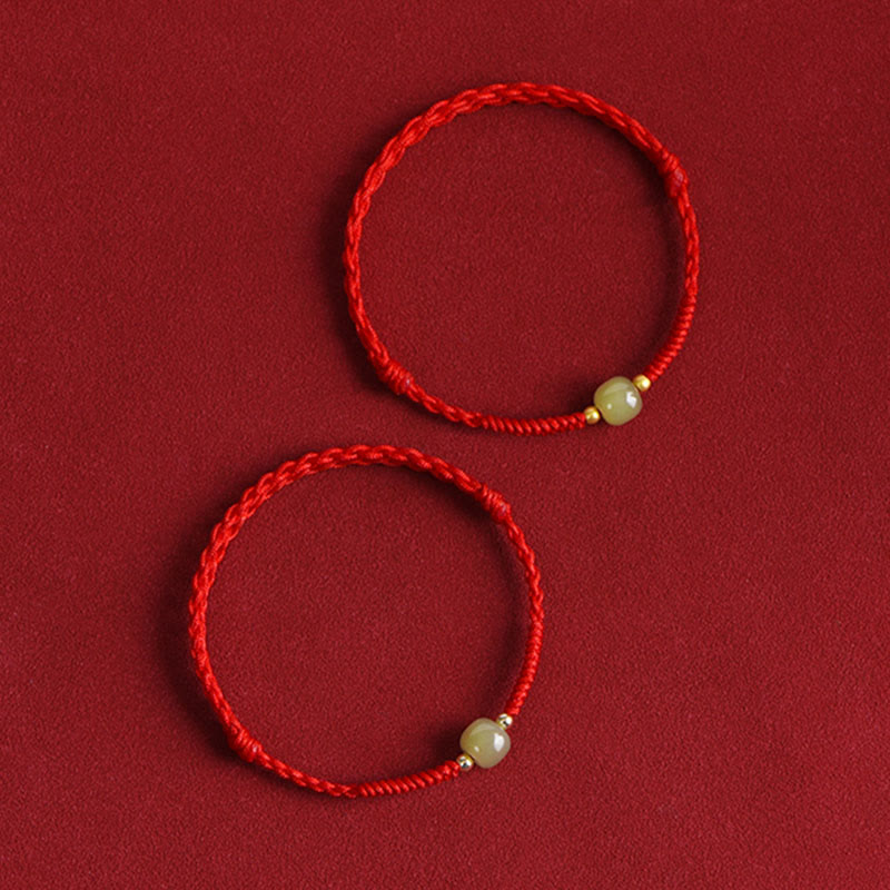 Twisted red cord jade beads gold spacers bracelet artistic display