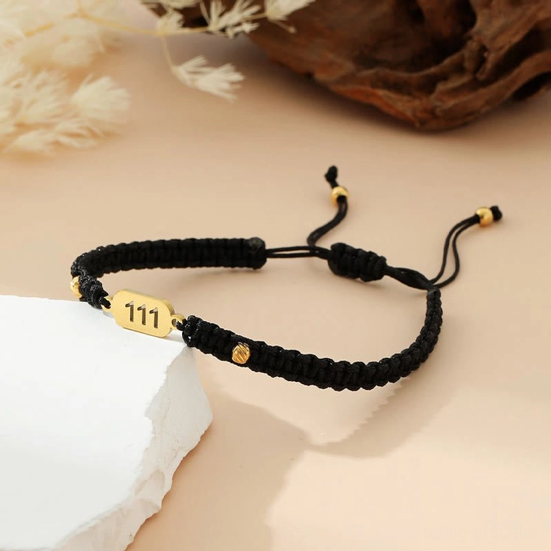 111 black red braided angel number bracelet with gold tag and adjustable design