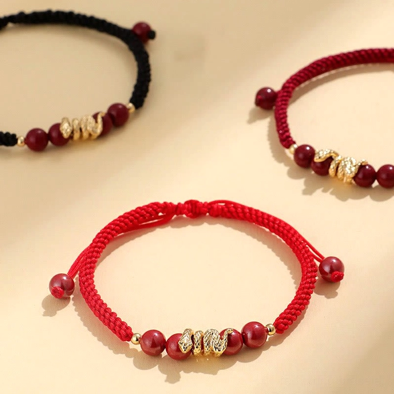 Close up full view of 2025 Year of Snake cinnabar red string bracelet