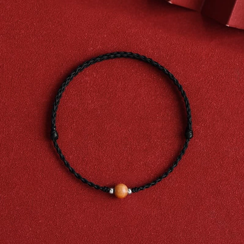 6mm peach wood bead black cord bracelet - compact evil spirit protection design