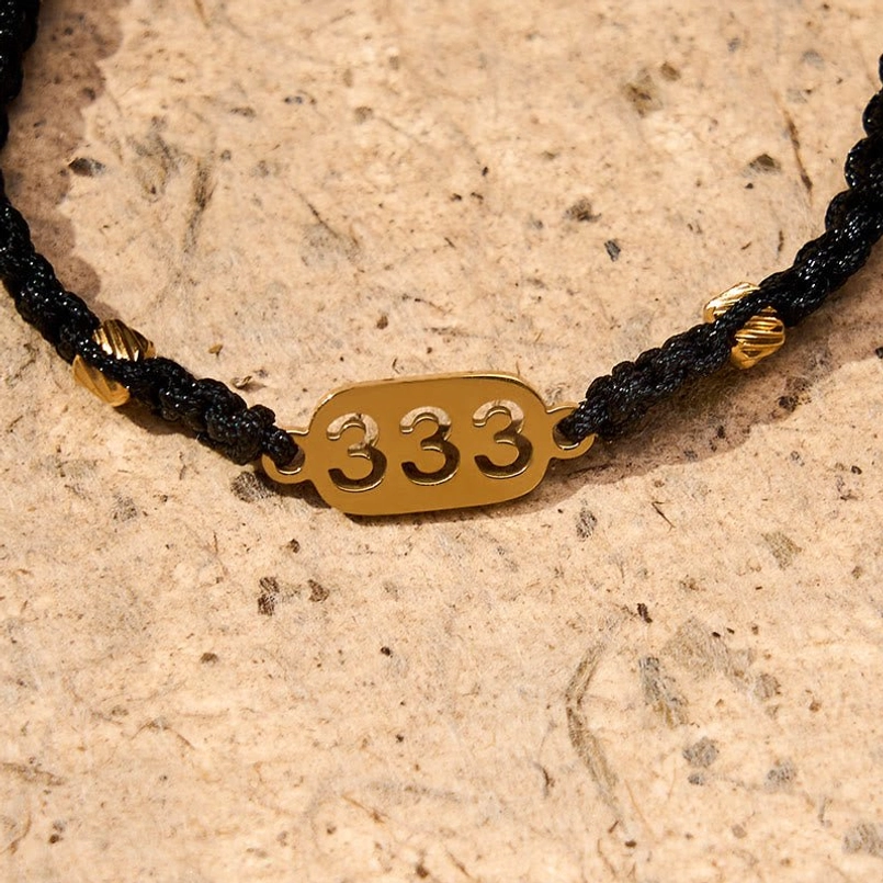 777 angel number black red braided bracelet with gold accents