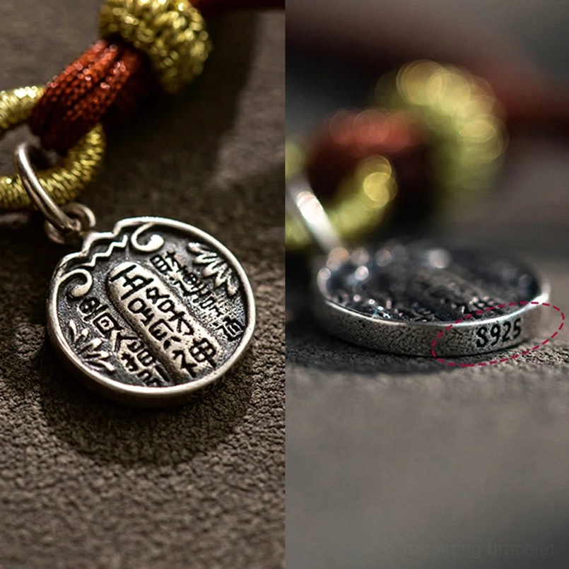 S925 marked 925 sterling silver charm close up with engraved Chinese characters