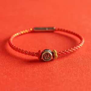 925 sterling silver fu character red string bracelet flat lay on red background
