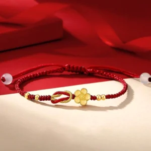 925 sterling silver sakura red string bracelet flat lay on red gift box backdrop