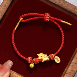 925 sterling silver year of the horse lucky red string bracelet top view on wooden velvet tray