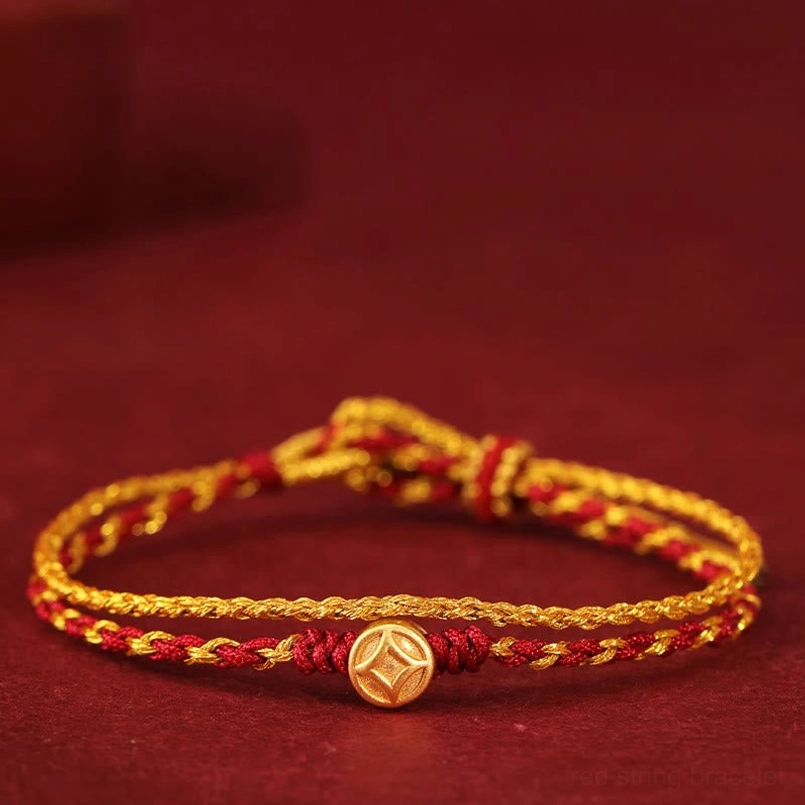 999 gold copper coin charm red string bracelet close up view