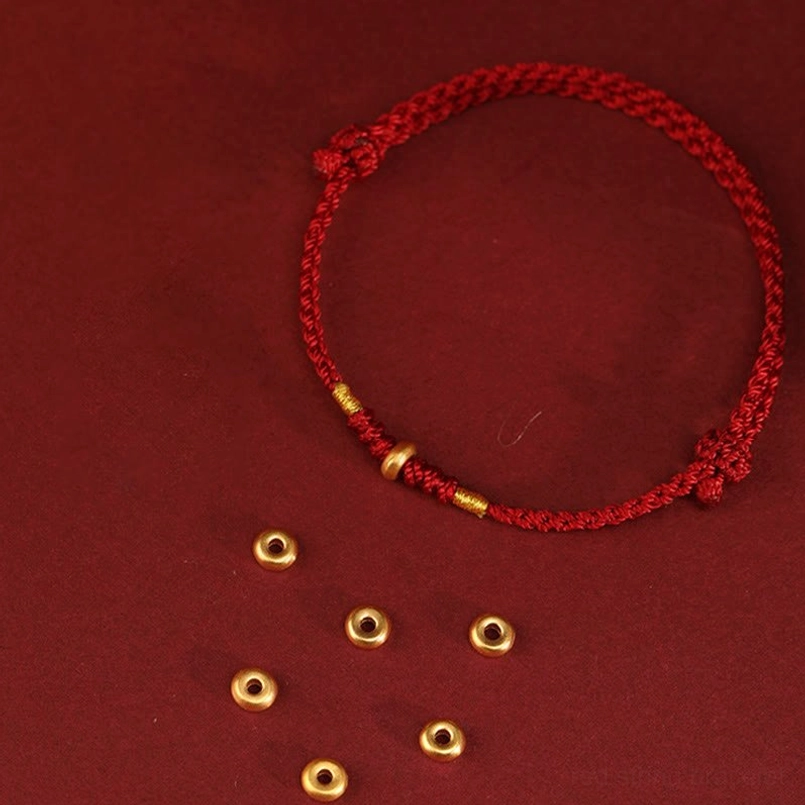 Red string bracelet with loose 999 gold spacer beads included