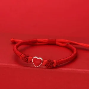 999 Sterling Silver 3D Heart Red String Bracelet front view on solid red background