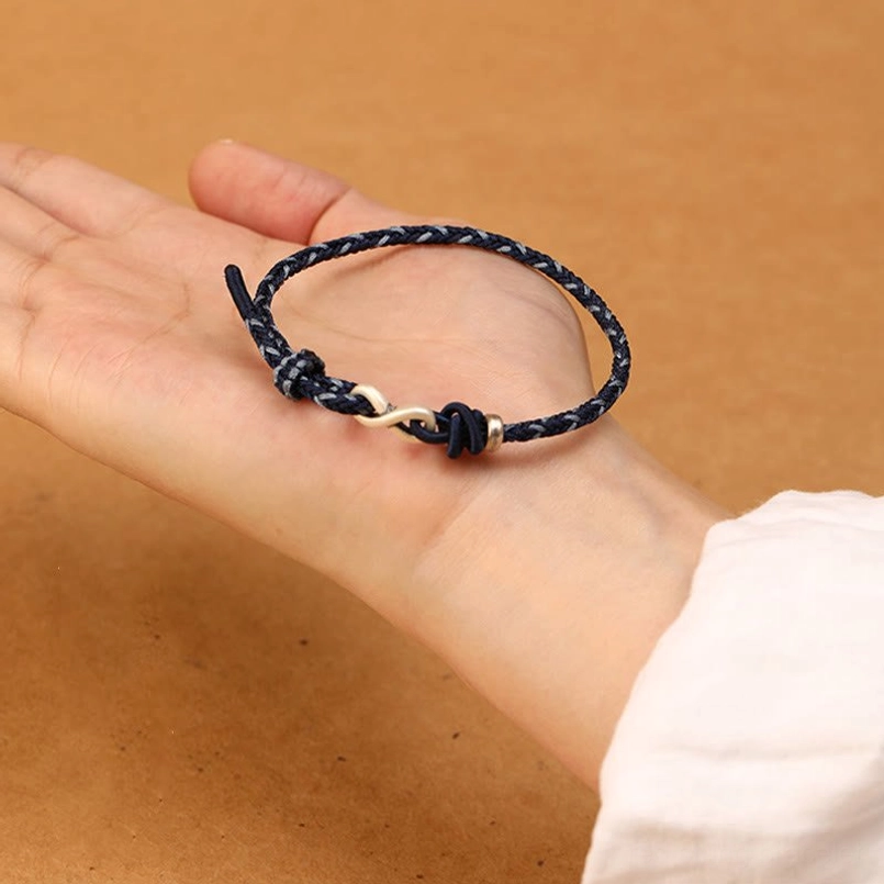 999 sterling silver endless knot bracelet displayed with natural rope weaving