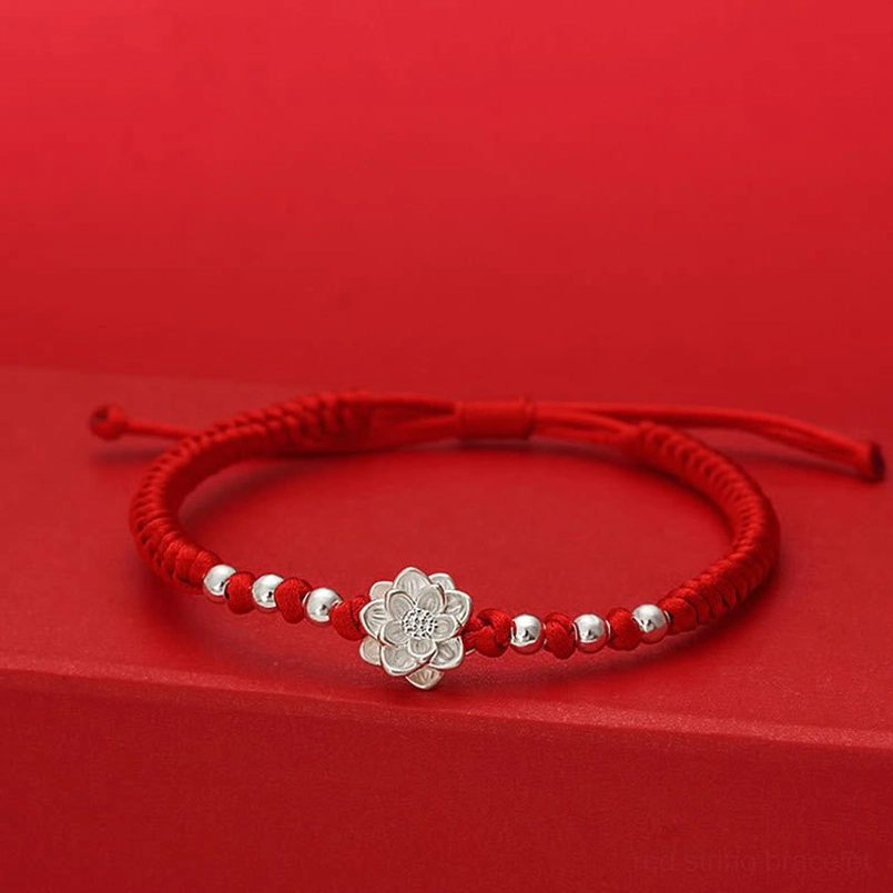 999 sterling silver lotus red string luck bracelet flat front view on red background