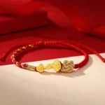 999 Sterling Silver Ruyi Fu Character Red String Fortune Bracelet Flat Lay