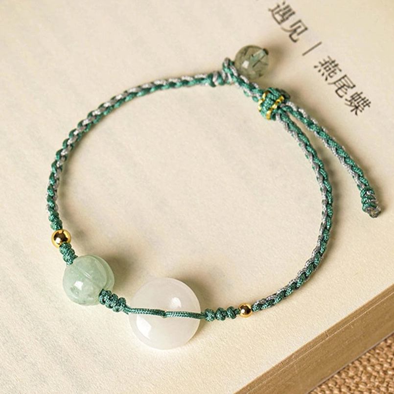 Adjustable braided jade peace buckle bracelet with green cord and pumpkin bead