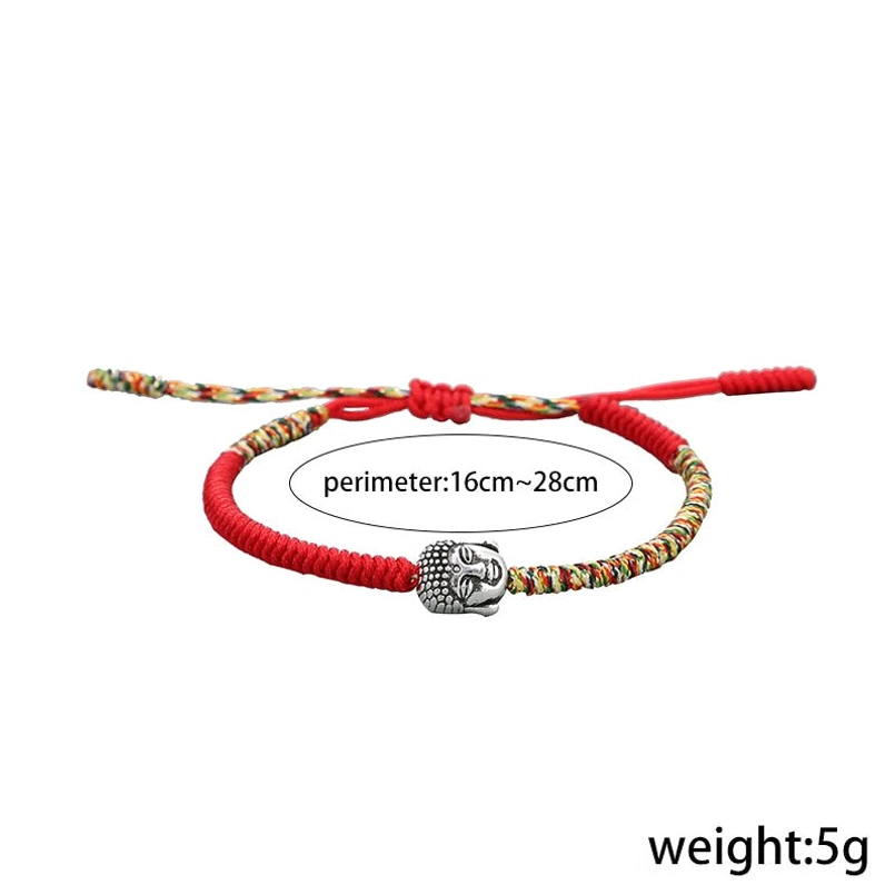 Adjustable size colorful King Kong Knot red string bracelet on plain light gray background