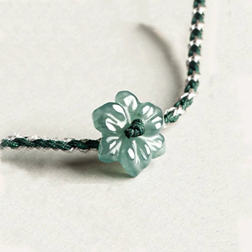 Adjustable knot detail of hand braided green string jade orchid bracelet