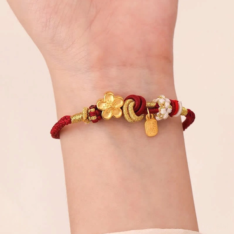 Adjustable red string bracelet with peach blossom gold charm for romance and protection