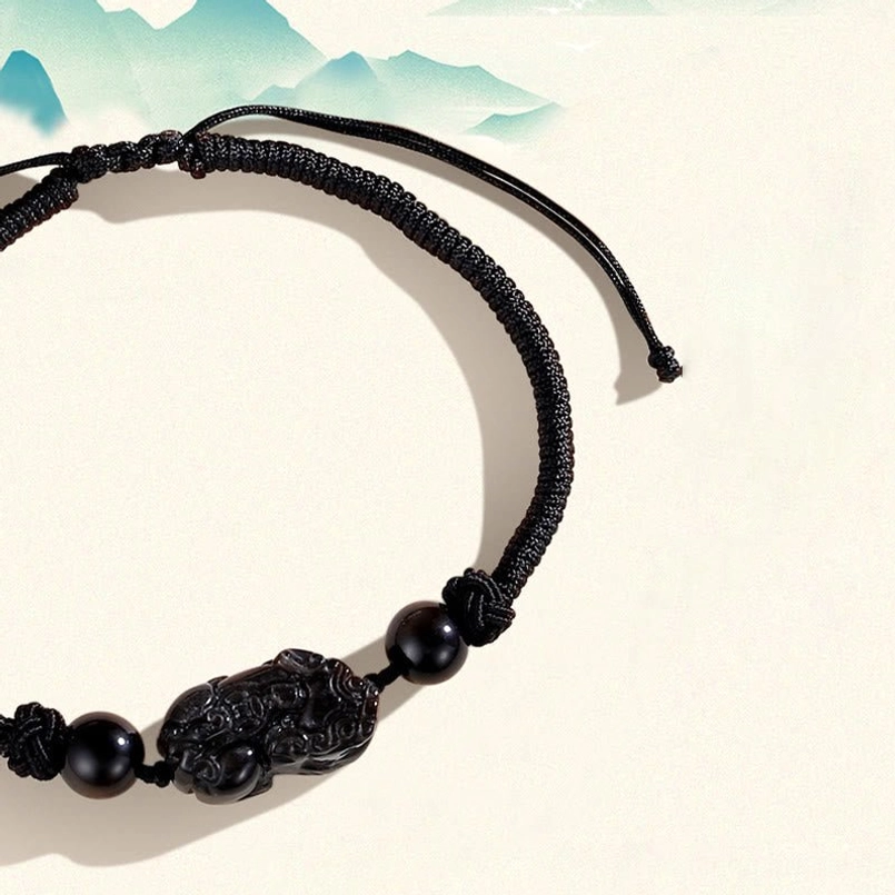 Adjustable black pixiu braided rope bracelet with obsidian charm knots detail