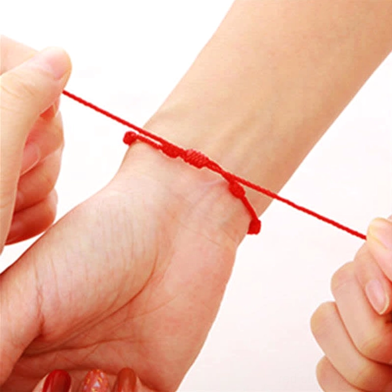 Adjustable sliding knot red string bracelet fitting tutorial close-up