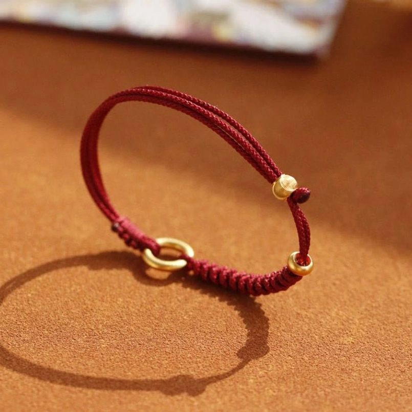 Adjustable Red String Bracelet With Gold Peace Buckle Oblique View