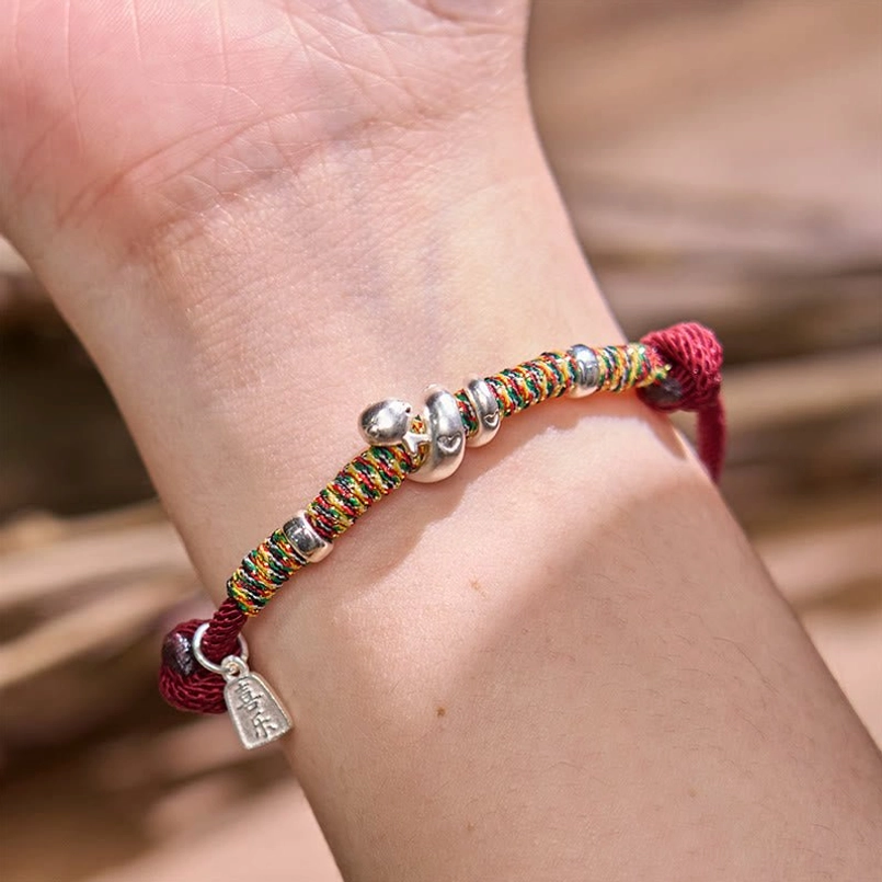 999 Sterling Silver Year of Snake Red String Bracelet side view worn on wrist
