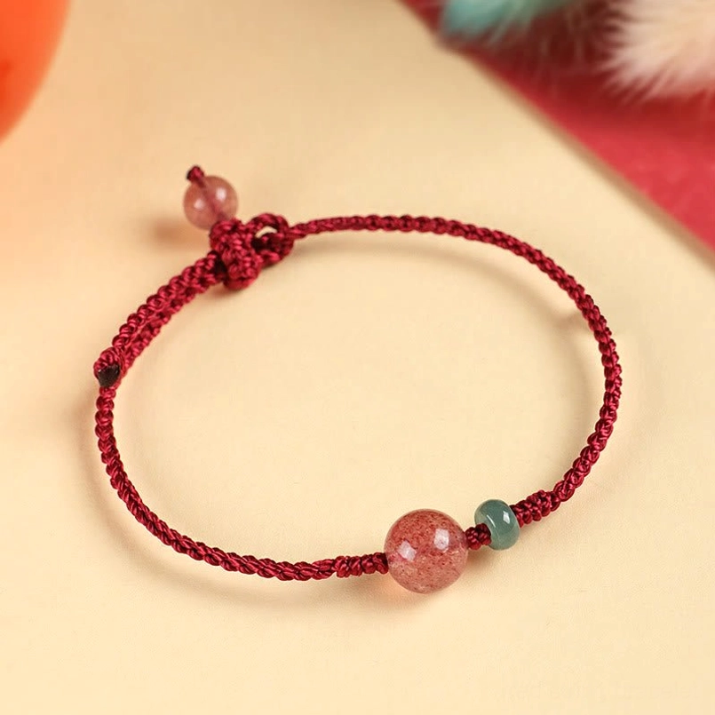 Red string bracelet with strawberry quartz and jade bead adjustable knot detail