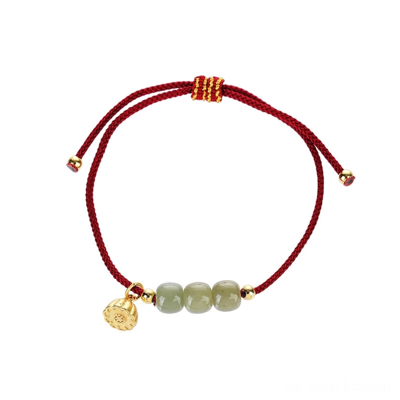 Red braided Hetian jade lotus bracelet on pure white background with adjustable knot