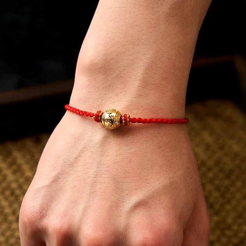 Adjustable red string Kabbalah-style bracelet with protective mantra bead design