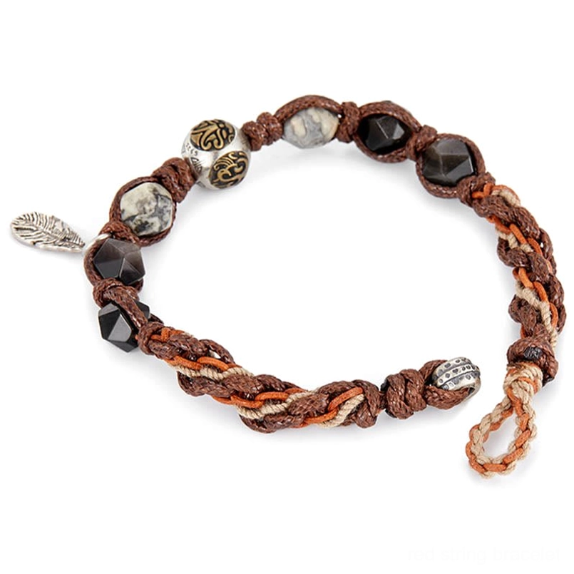 side view of adjustable red string obsidian bracelet on white background