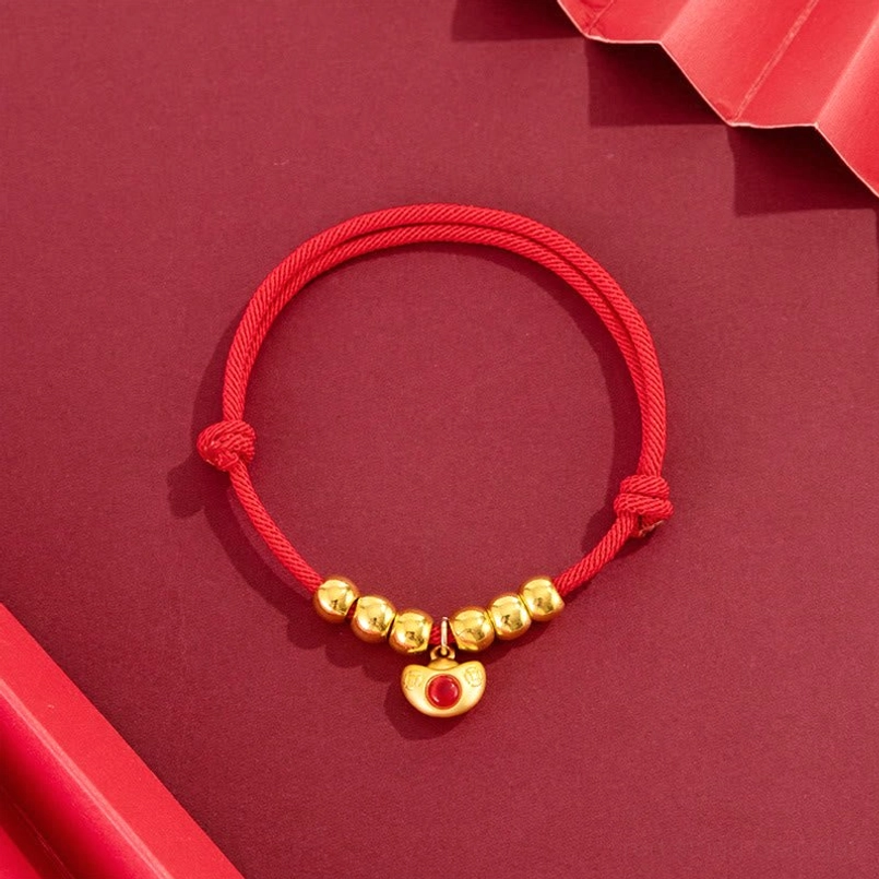 Adjustable red string pet collar with yuanbao ingot charm, flat lay display with gold beads and sliding knot