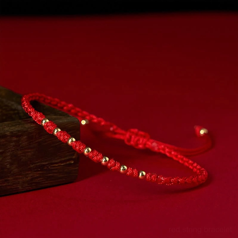 Handmade red string bracelet with adjustable sliding knots and silver beads