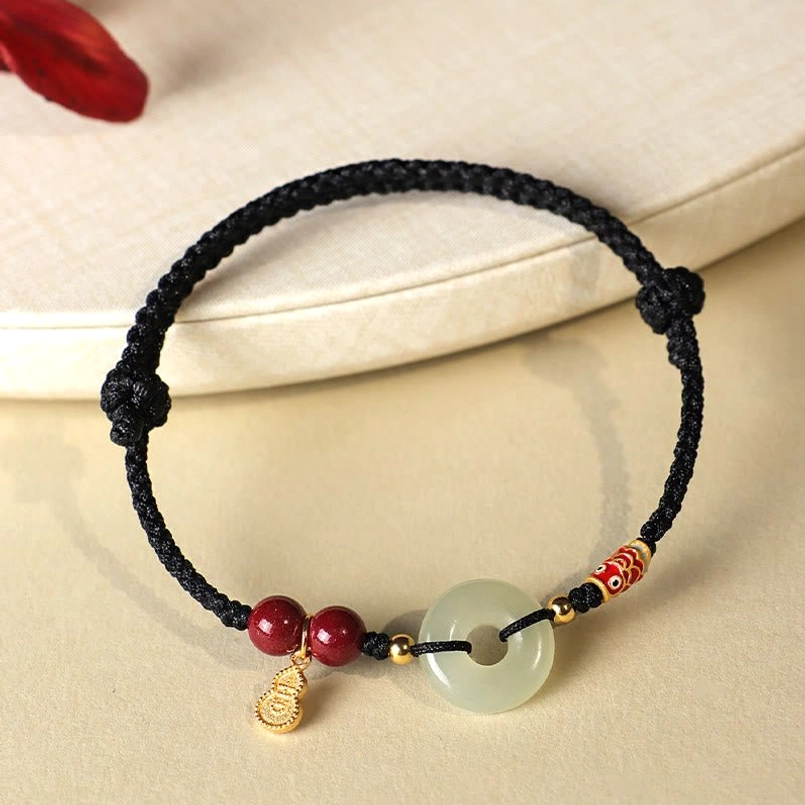 Adjustable sliding knot detail of red string protection bracelet