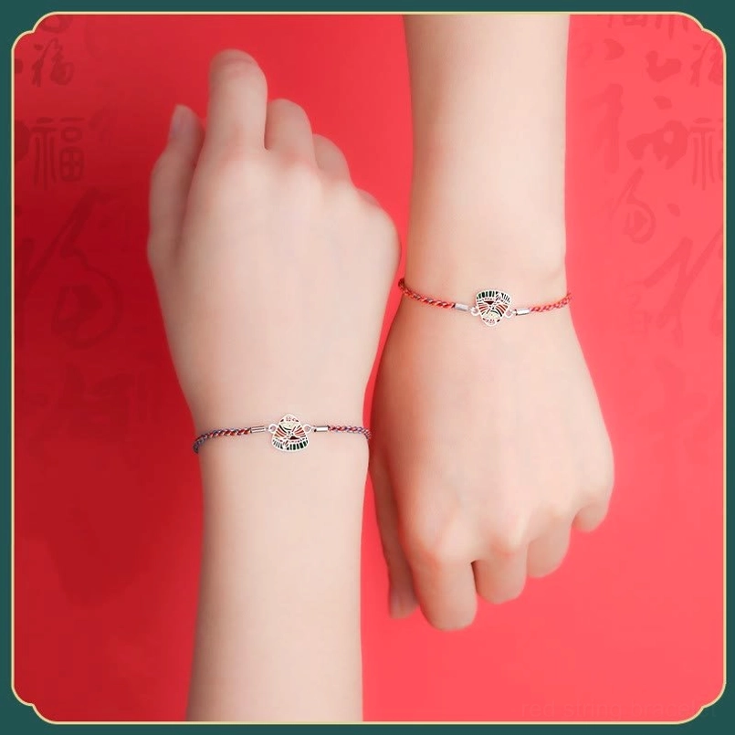 Adjustable sliding knot detail of handmade zongzi red string luck bracelet