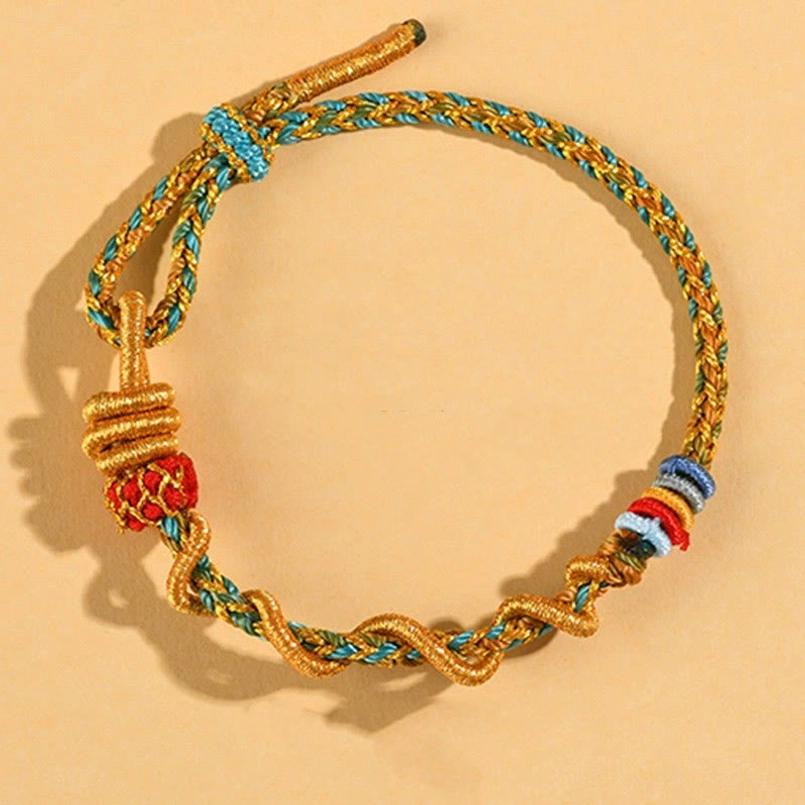 Adjustable Snake Year luck bracelet with blue-gold-red mixed braided cord and knot tail