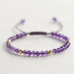 handmade 4mm natural amethyst braided string bracelet with gold plated copper beads close-up view