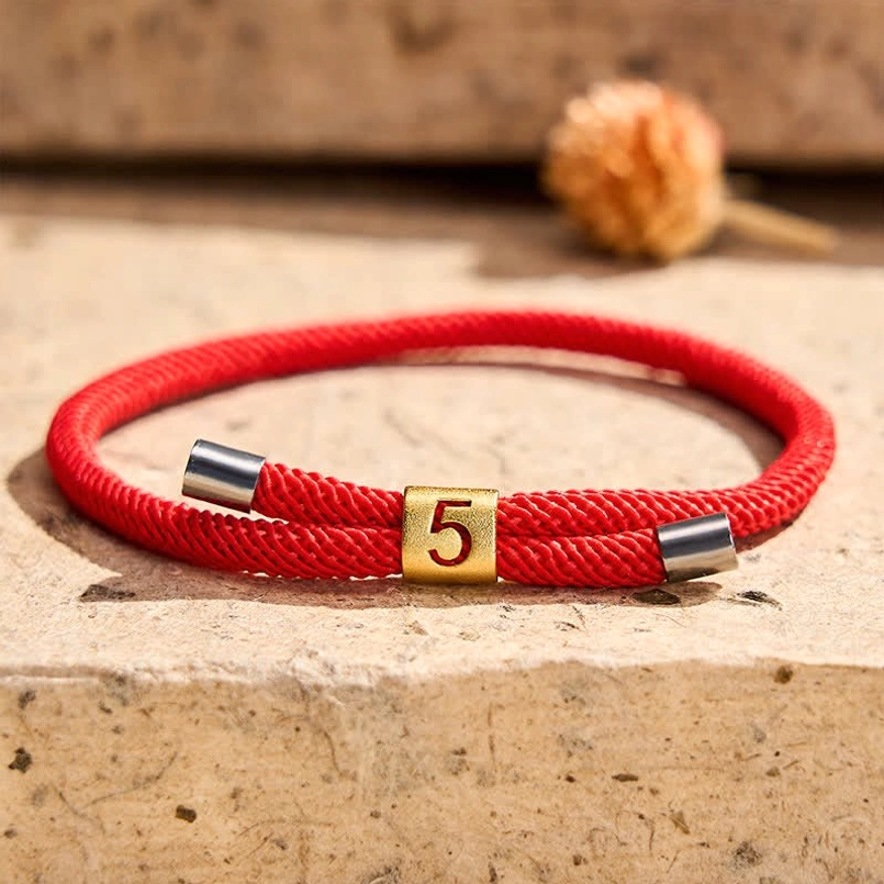 Angel number red string bracelet gold metal charm embossed detail