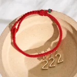 Angel number red string jade protection bracelet with gold charm, handcrafted braided red cord with natural jade bead accent