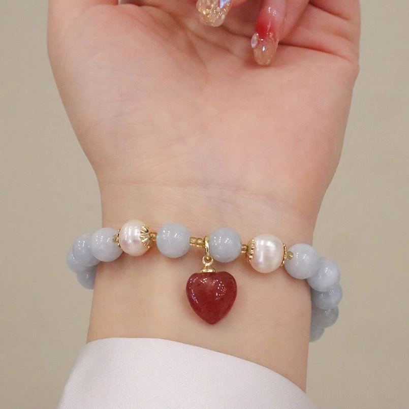 Handcrafted aquamarine gemstone bracelet held in hand, showing natural stone texture and detail