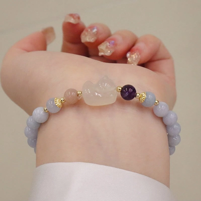 Aquamarine chalcedony cat charm bracelet with light blue beads and gemstone accent on wrist