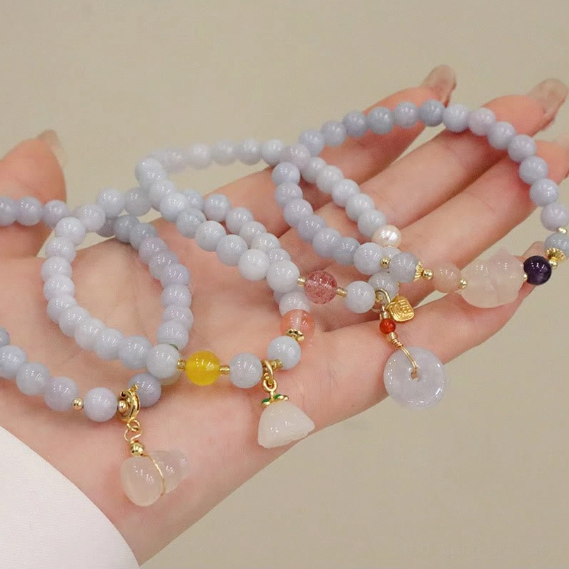 Aquamarine protection bracelet collection showing different charm variants and color variations