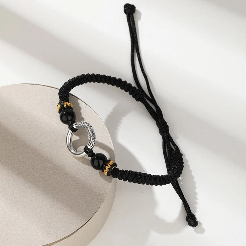 Black Braided Auspicious Clouds Peace Buckle Bracelet - Low Angle View with Adjustable Cord