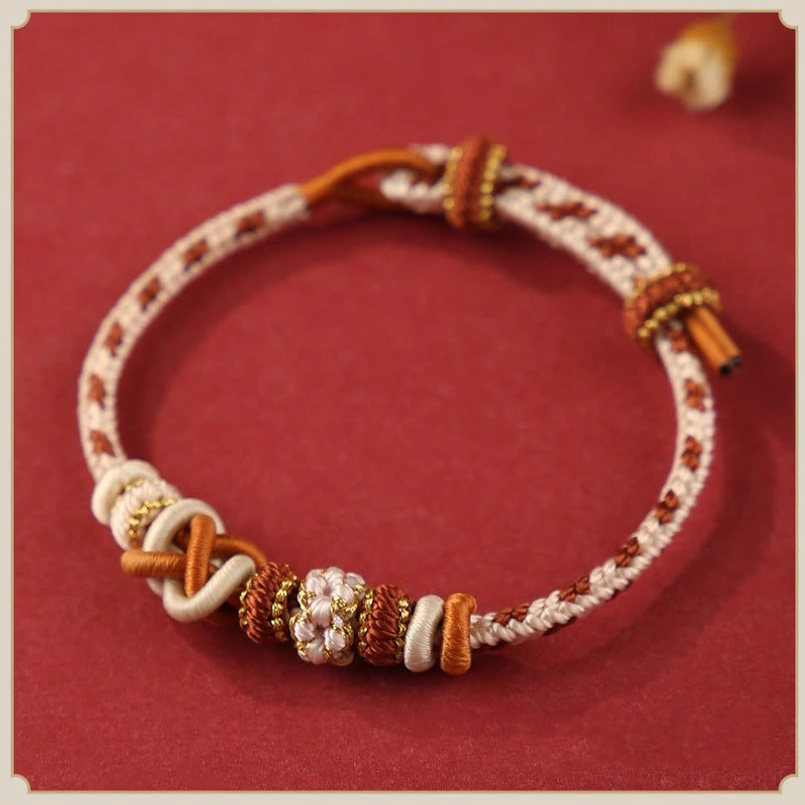 Neutral Beige Braided Peace Knot Red String Bracelet Flat Lay