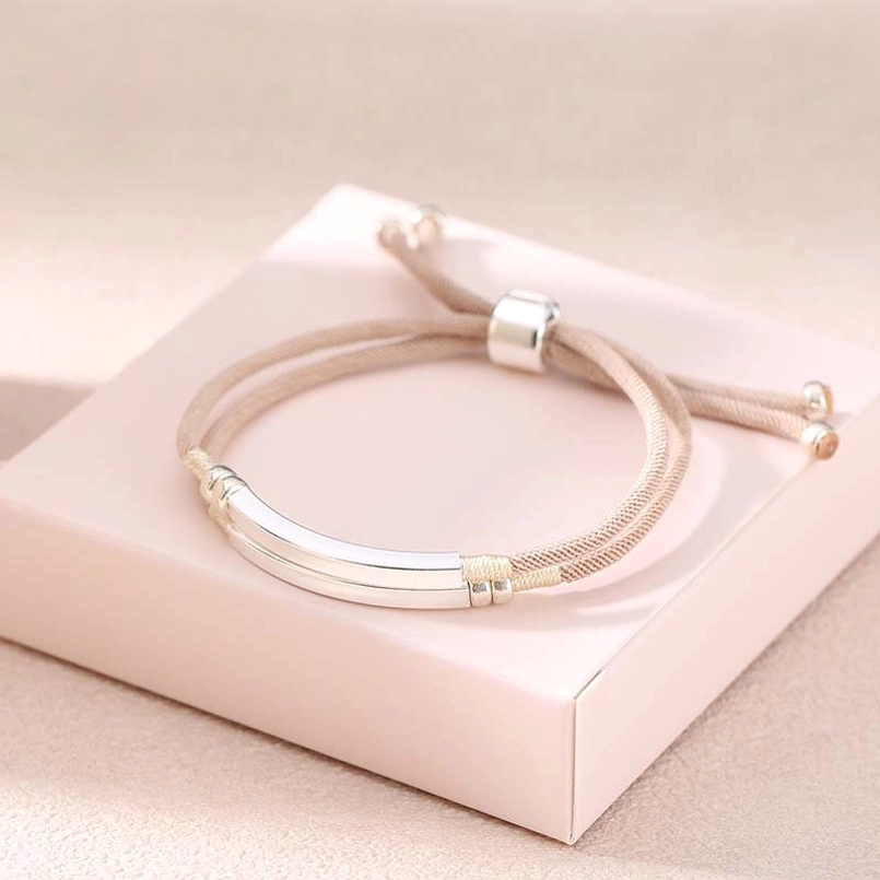 Beige khaki braided cord bracelet with thin weave and dual silver bars with sliding clasp mechanism