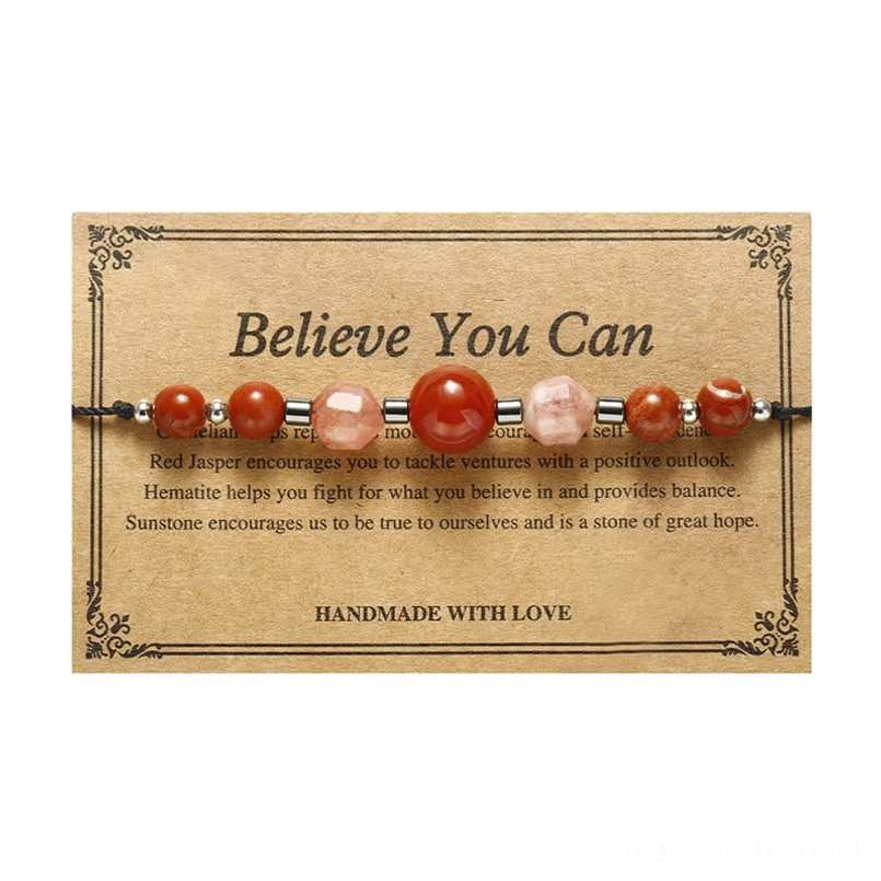 Carnelian sunstone red jasper hematite bracelet lifestyle styled shot on natural surface