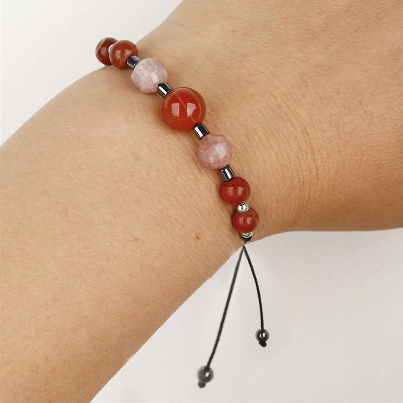 Carnelian red jasper sunstone hematite power bracelet worn on wrist - wearing effect