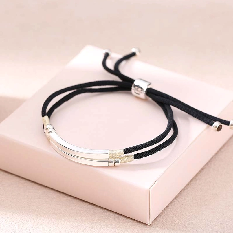 Black braided cord bracelet with sterling silver bar accent and adjustable pull-tie closure