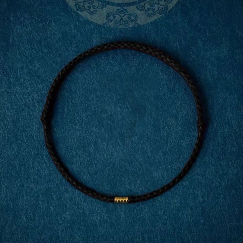 Black braided string bracelet with metal beads styling versatility