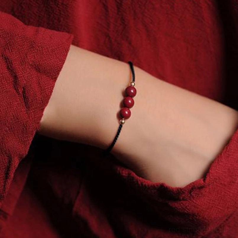 Black cord 3 cinnabar beads 14K gold plated bracelet flat lay