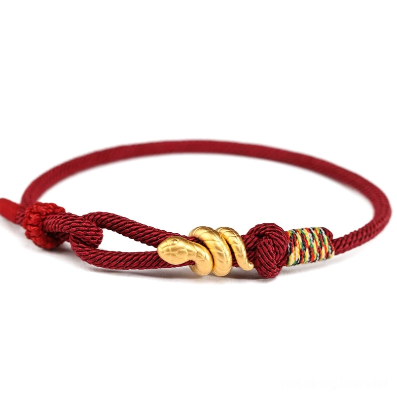 black braided 999 gold snake protection bracelet close up view