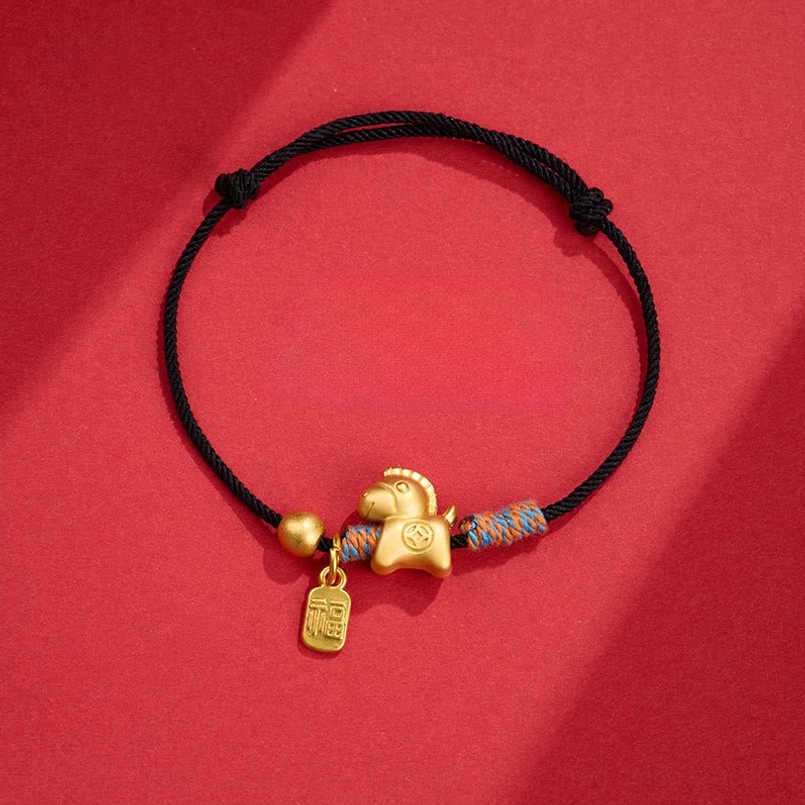Horse Fu charm black string bracelet flat lay on red background